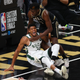 JUNE 29: Giannis Antetokounmpo, No. 34, of the Milwaukee Bucks is injured against Clint Capela, No. 15, of the Atlanta Hawks during the second half in Game Four of the Eastern Conference Finals at State Farm Arena on June 29, 2021 in Atlanta, Georgia.